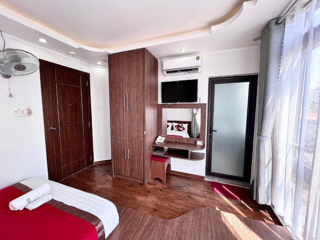 Postel nebo postele na pokoji v ubytování Le Tuan Minh Hotel