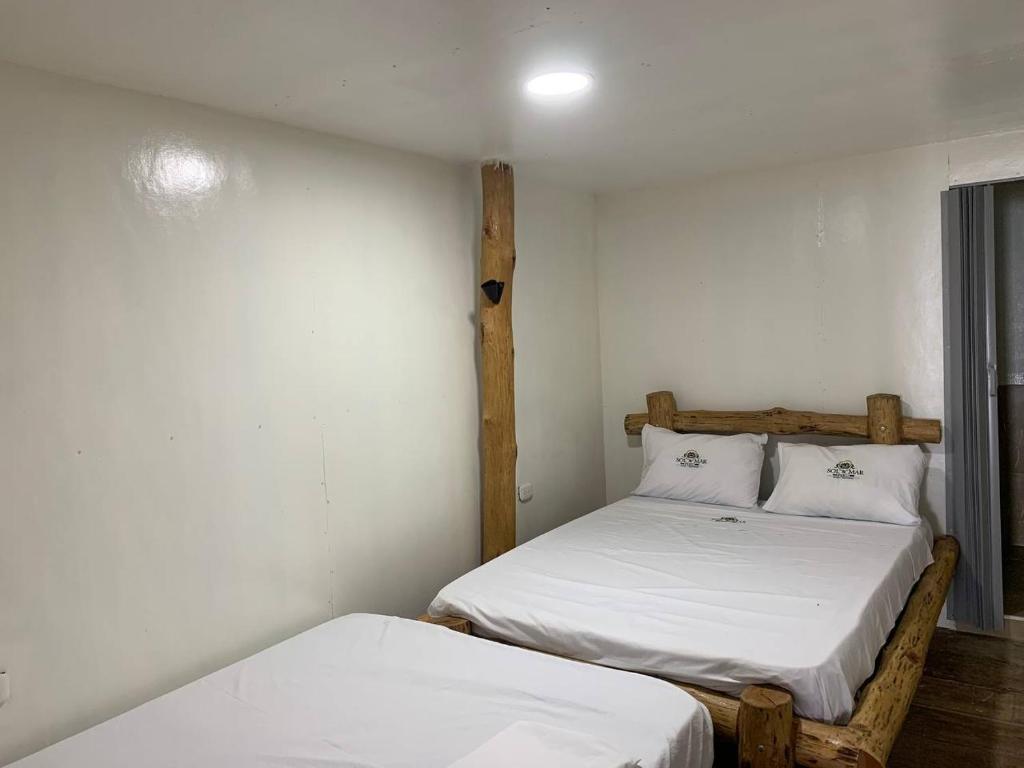 سرير أو أسرّة في غرفة في Venido Del Mar. Neymar