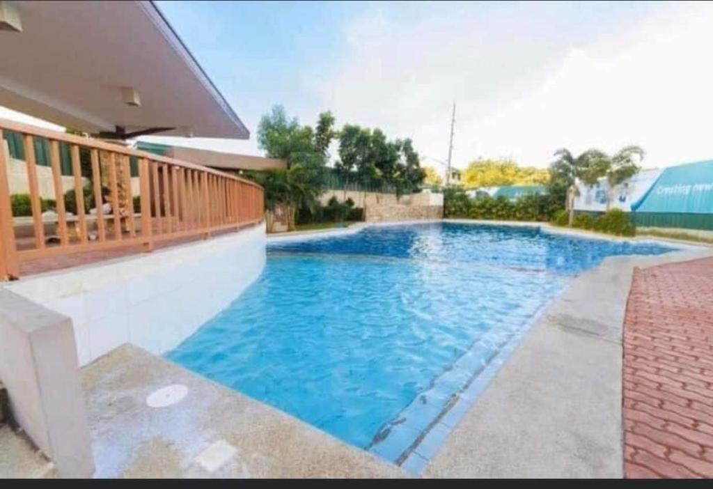 a swimming pool with blue water in a house at condotel anuva in Manila