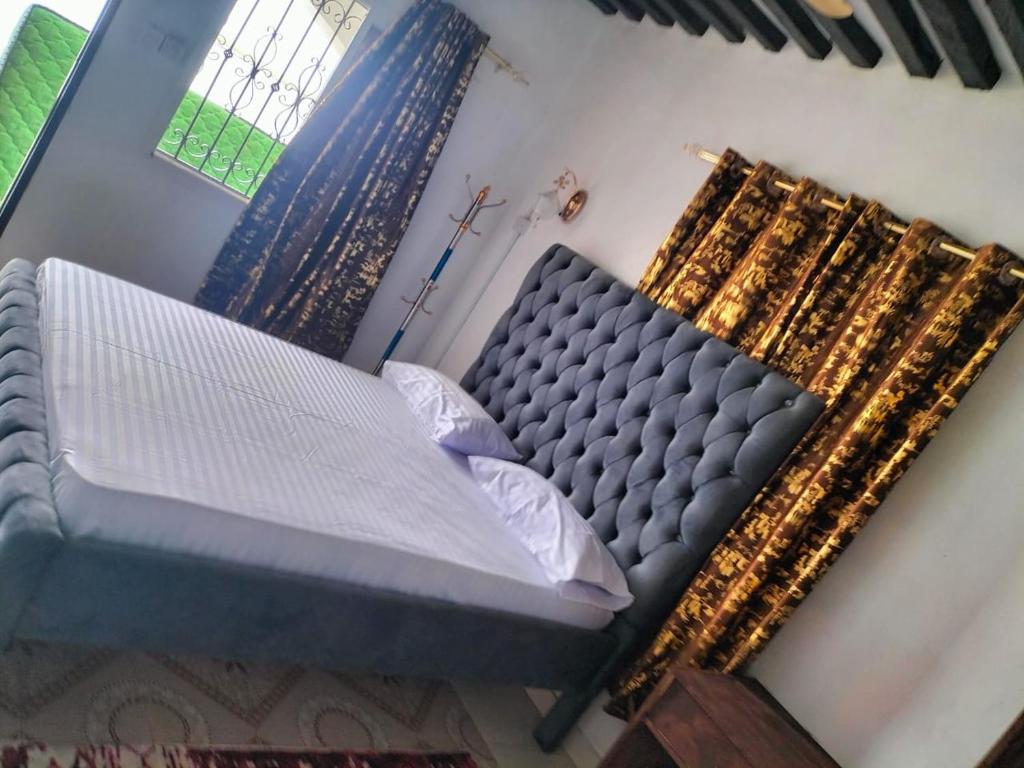 an overhead view of a bed in a bedroom at Olympic Lamu sea front house - 2 bedroom All ensuite in Lamu