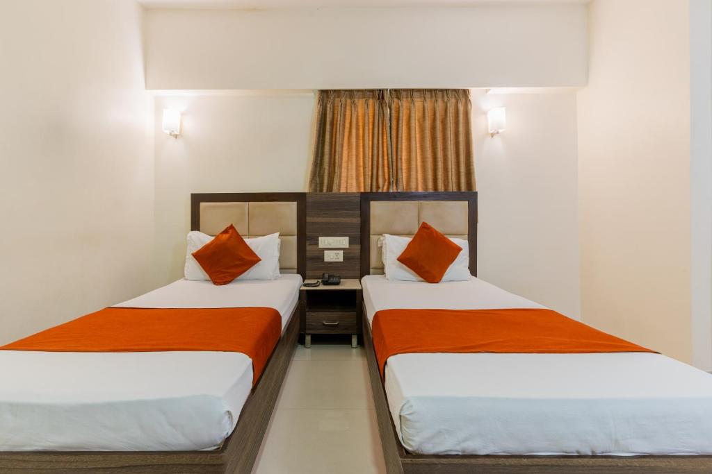 Postel nebo postele na pokoji v ubytování Hotel Prime
