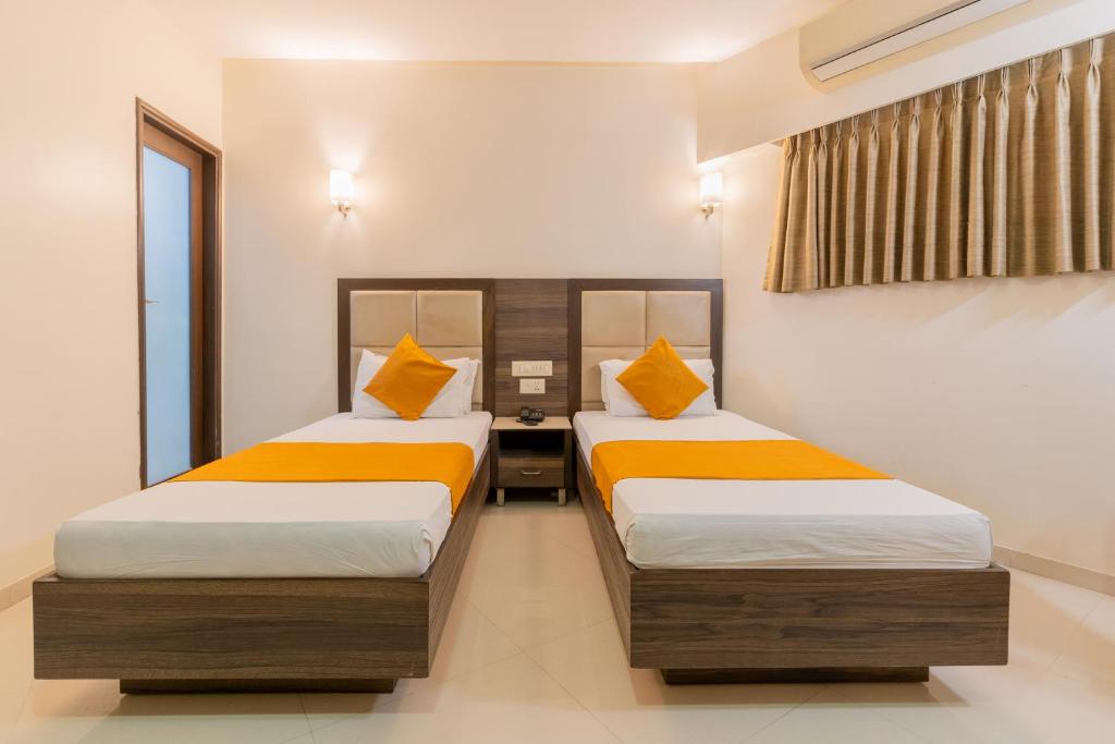 Postel nebo postele na pokoji v ubytování Hotel Prime