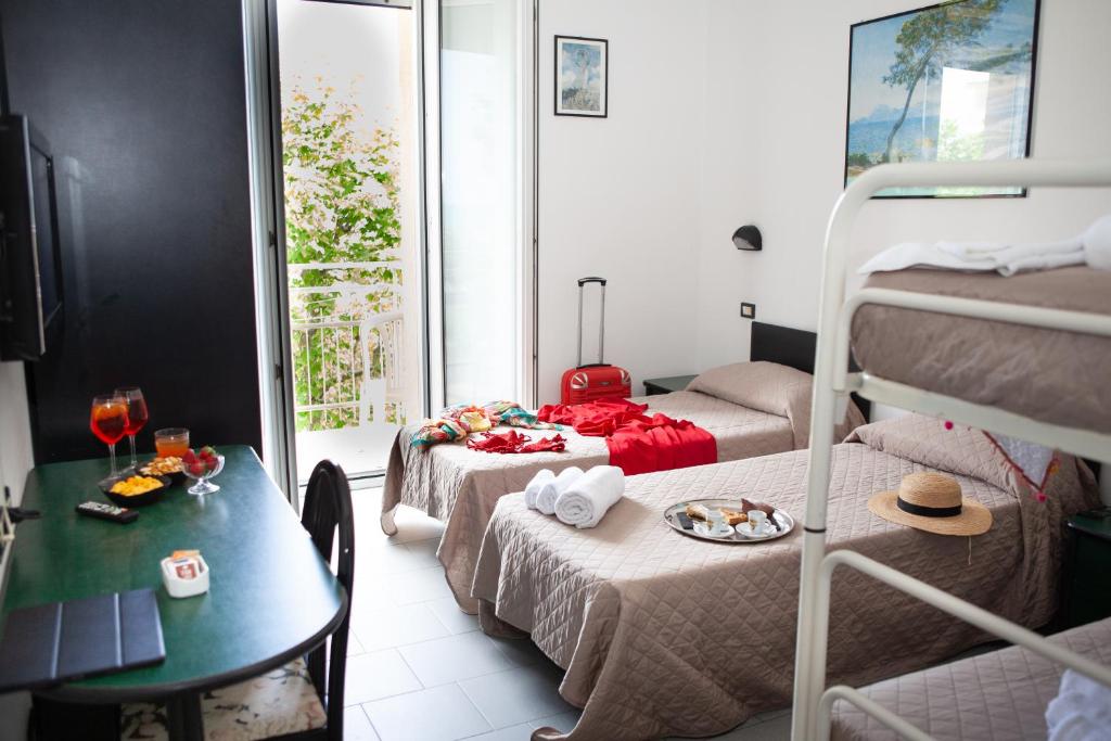 Postel nebo postele na pokoji v ubytování Hotel La Torretta Bramante