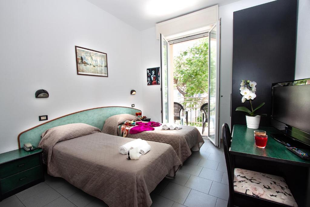 Postel nebo postele na pokoji v ubytování Hotel La Torretta Bramante