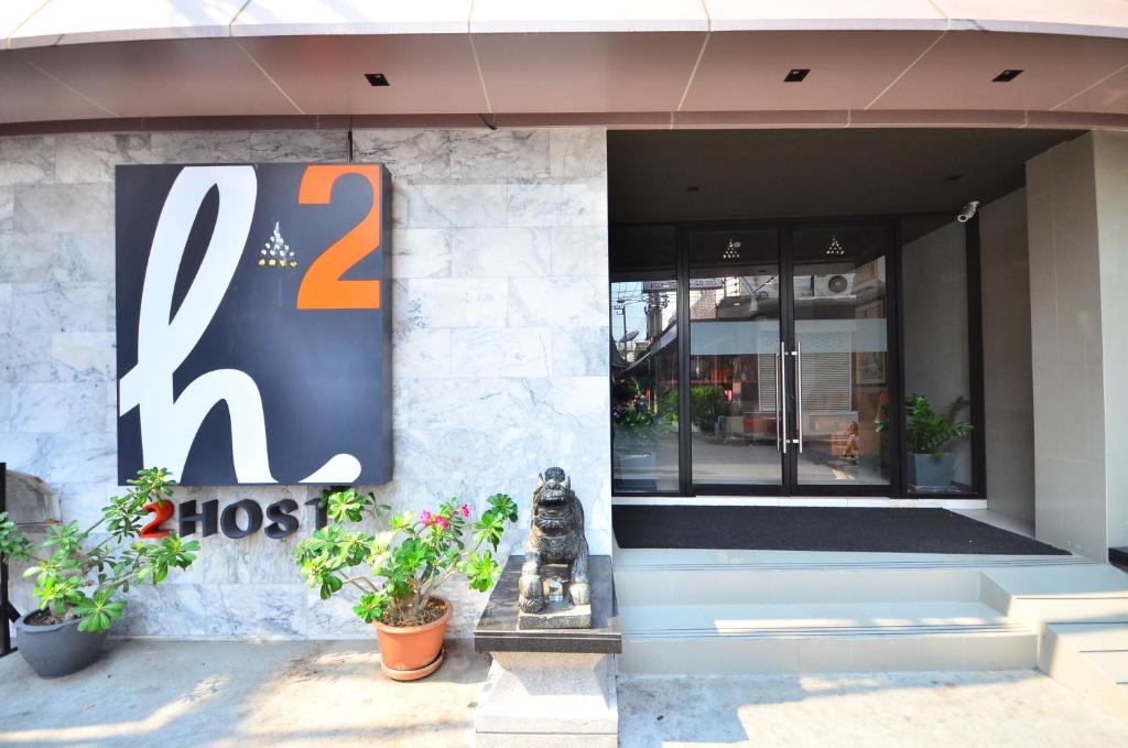 a store with a sign on the front of a building at H2 Hotel in Bangkok