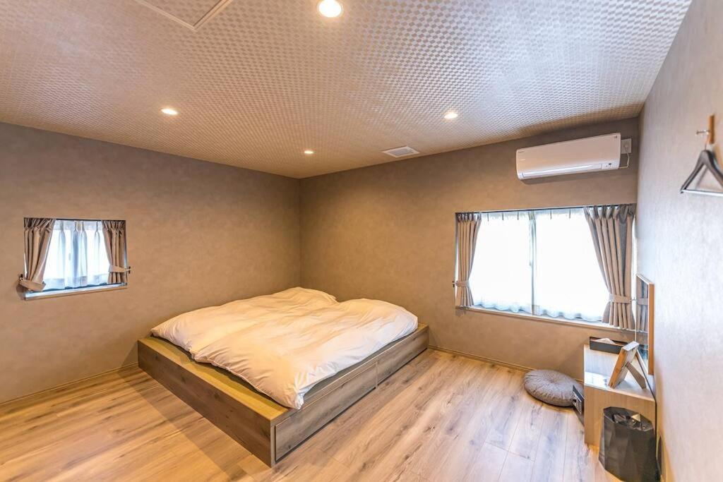Postel nebo postele na pokoji v ubytování 香季庵Euphoria