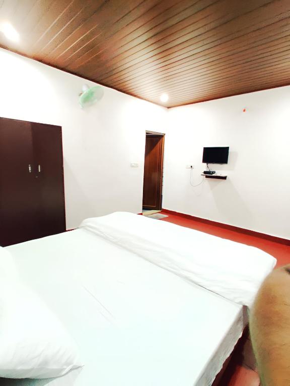 Postel nebo postele na pokoji v ubytování Humble Nest Coorg