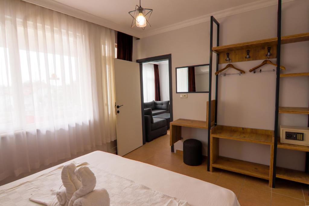 Postel nebo postele na pokoji v ubytování New Garden Hotel Side