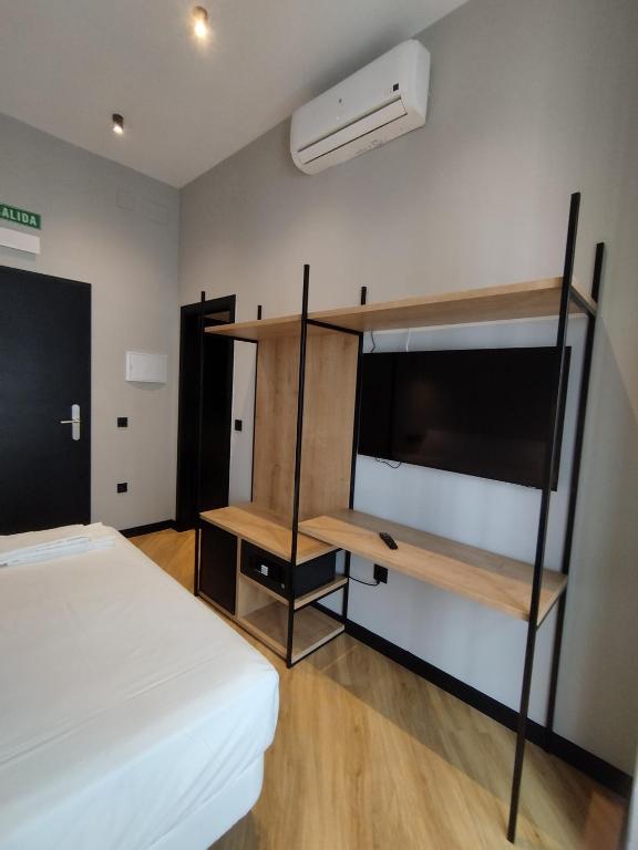 Postel nebo postele na pokoji v ubytování Sweet Sevilla Hostel