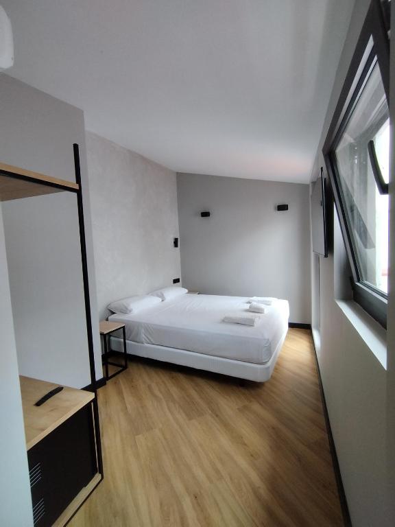 Postel nebo postele na pokoji v ubytování Sweet Sevilla Hostel