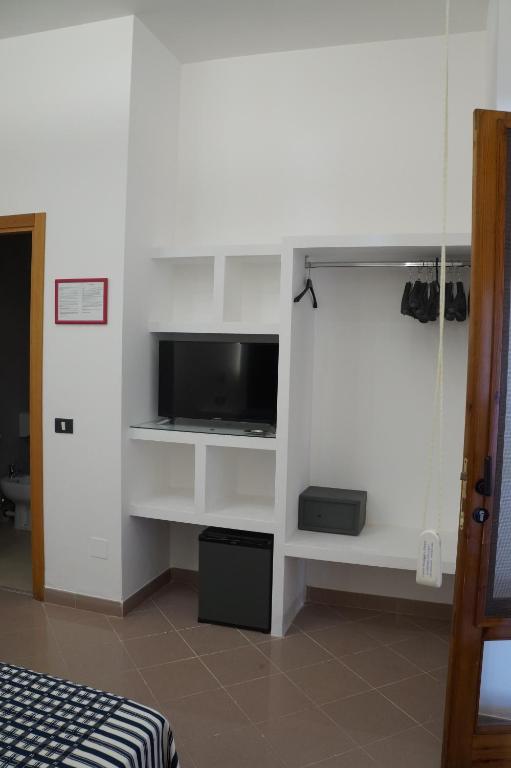 TV a/nebo společenská místnost v ubytování Hotel Parco Carabella