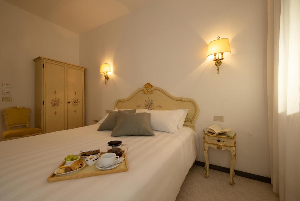 Postel nebo postele na pokoji v ubytování Hotel Guerrini