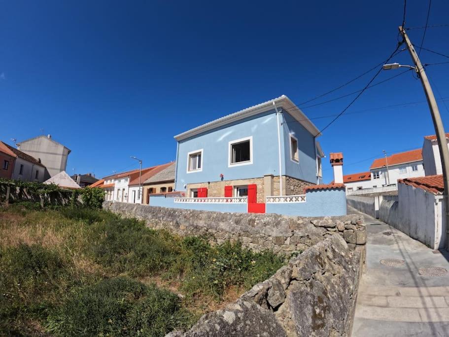a house on top of a stone wall at Hideaway Galicia Corrubedo in Corrubedo