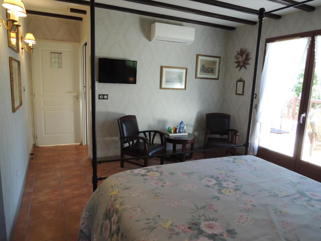Postel nebo postele na pokoji v ubytování Via Bahia - Maison d'hôtes