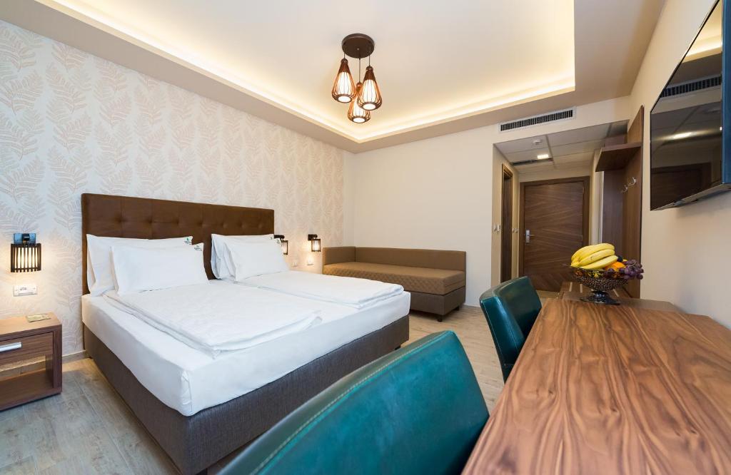 Postel nebo postele na pokoji v ubytování Hotel Borkovac