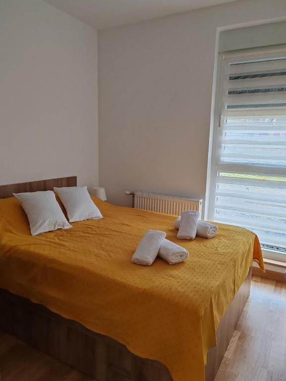Postel nebo postele na pokoji v ubytování Angelika apartman Divčigora
