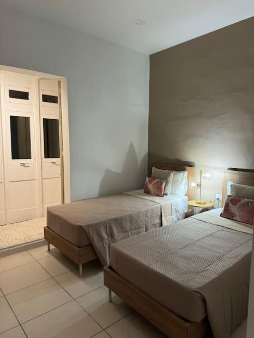 Postel nebo postele na pokoji v ubytování Townhouse 26 in Sliema, Malta