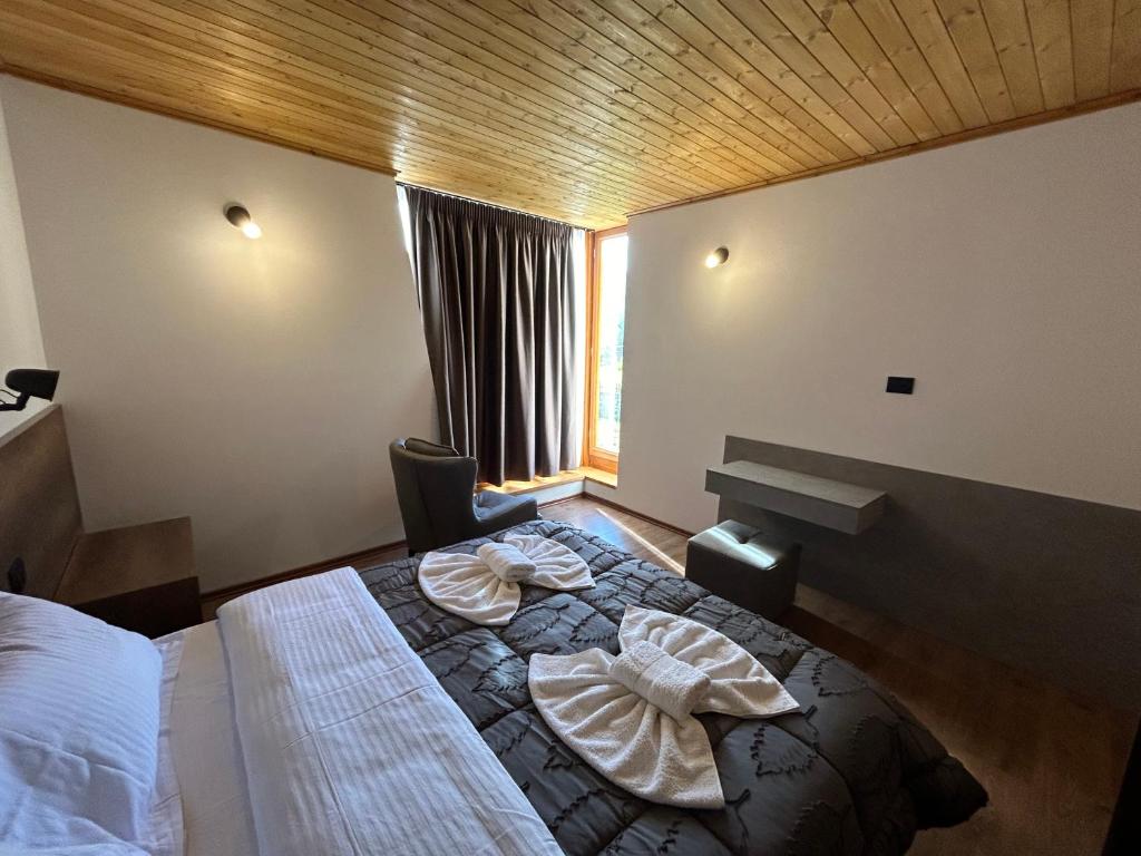 Postel nebo postele na pokoji v ubytování Bujtina Terthorja