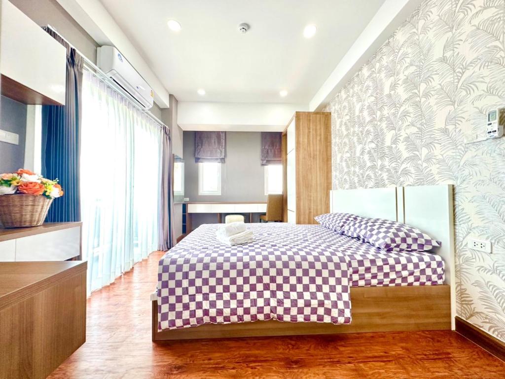 Ένα ή περισσότερα κρεβάτια σε δωμάτιο στο Arroz Residence