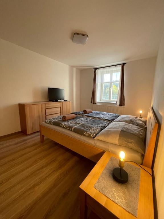 Letto o letti in una camera di Apartmán Kameňák