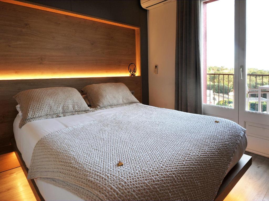 Postel nebo postele na pokoji v ubytování Hostal Rural Can Pau
