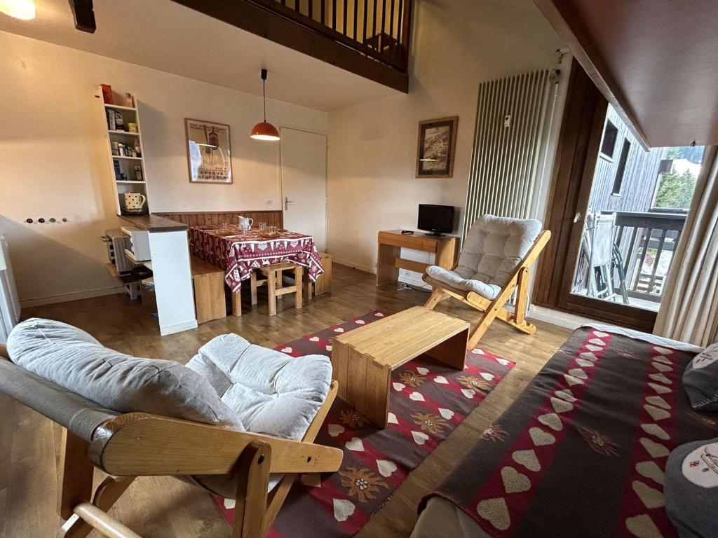 a living room with a couch and chairs and a table at Appartement Megève, 2 pièces, 6 personnes - FR-1-597-7 in Megève