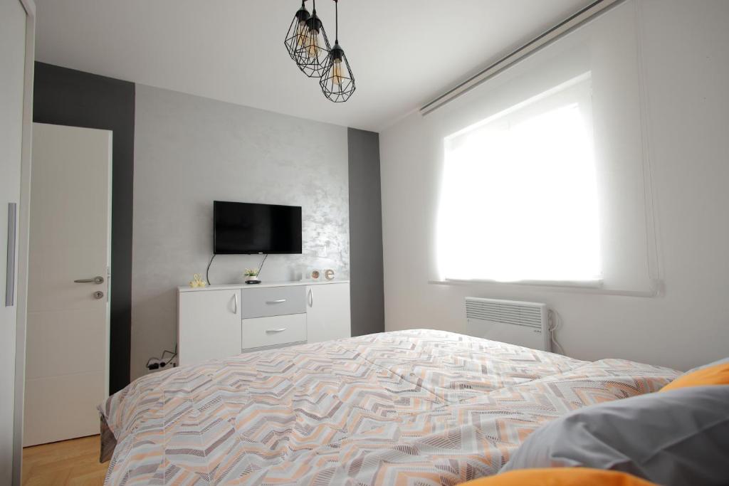 Postel nebo postele na pokoji v ubytování Apartman Zivic