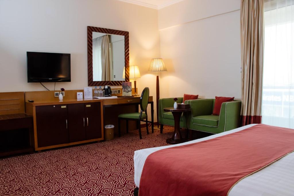 Postel nebo postele na pokoji v ubytování Dubai Grand Hotel by Fortune, Dubai Airport