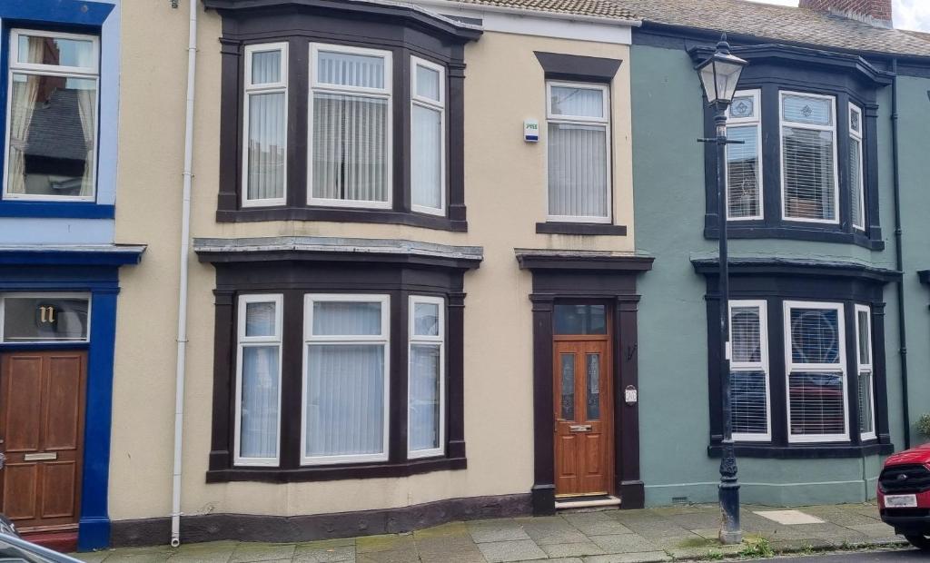 a row of houses on a city street at Traditional 3-Bed House on the Historic Headland in Hartlepool