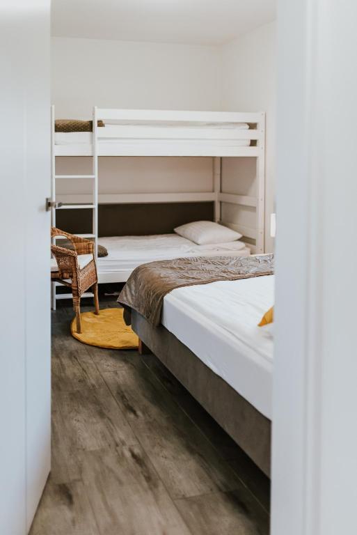 Posteľ alebo postele v izbe v ubytovaní APARTAMENTY LAS Zator
