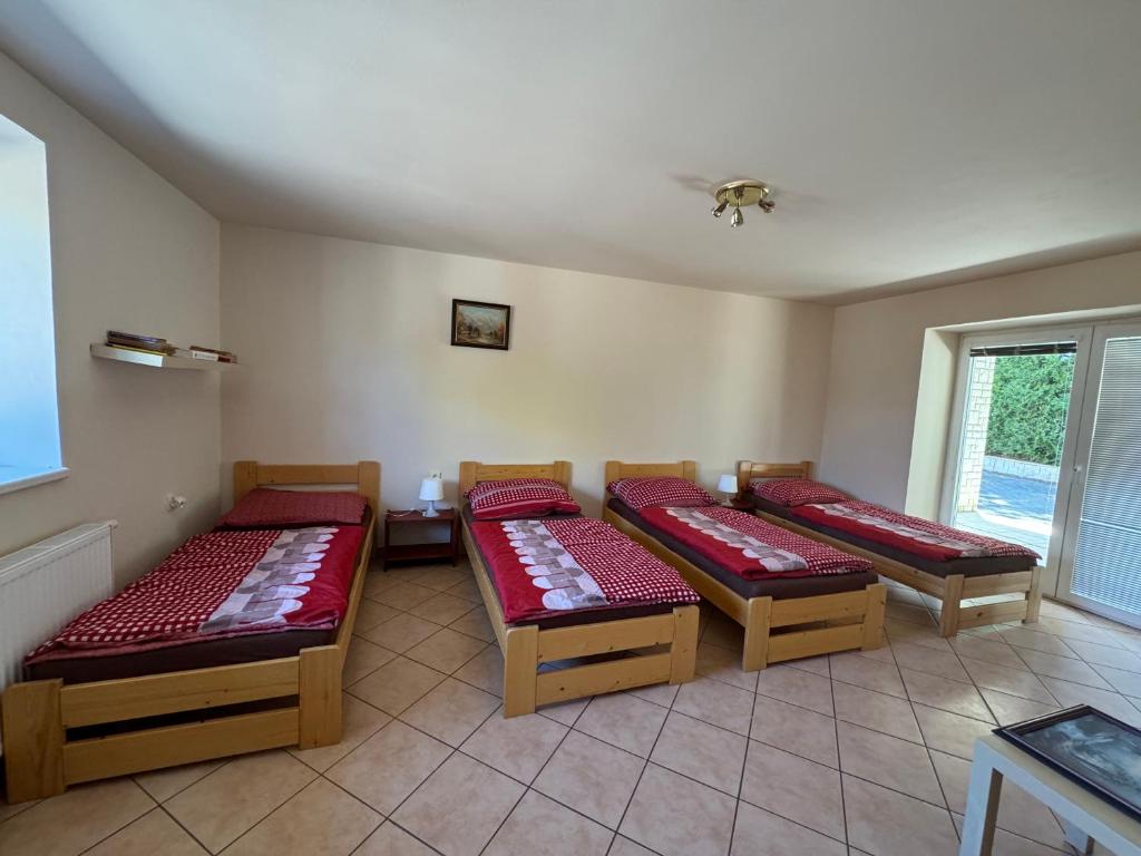 Postel nebo postele na pokoji v ubytování Apartmány Kněžičky