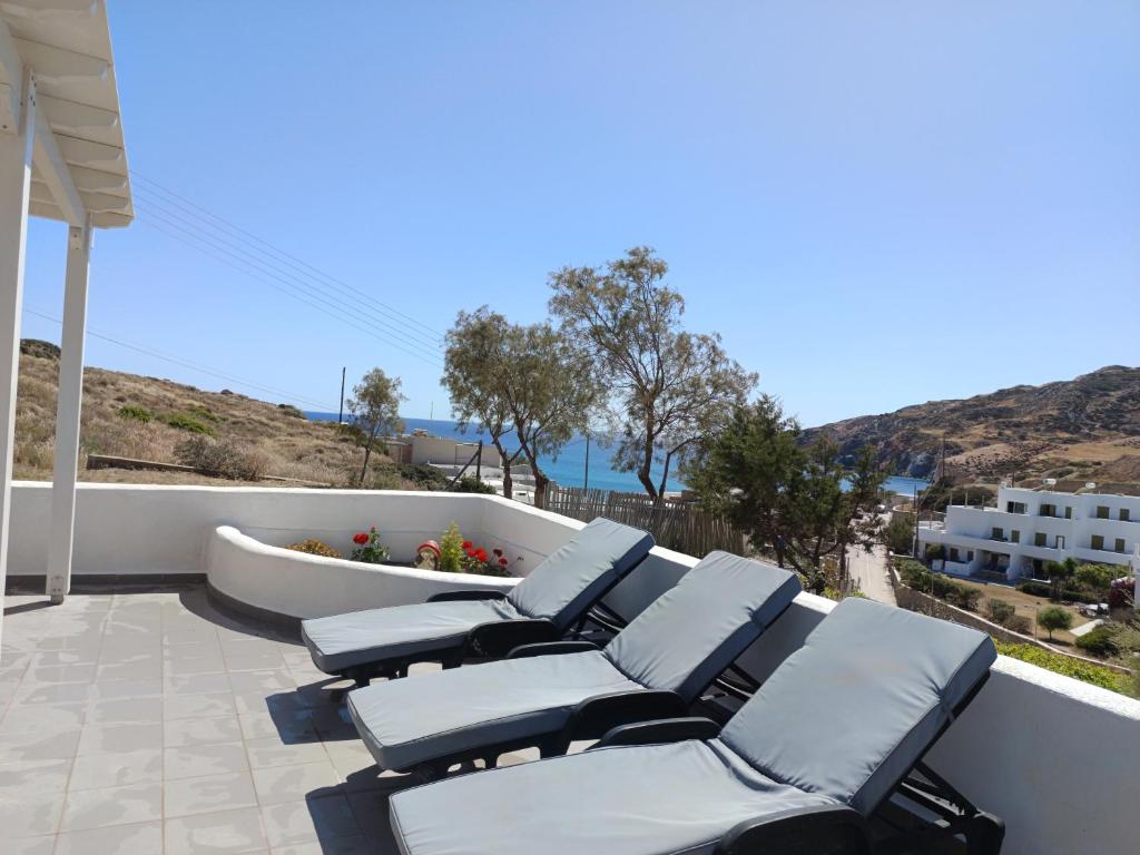 a group of chairs sitting on a patio at Summer House Paliochori in Paliochori