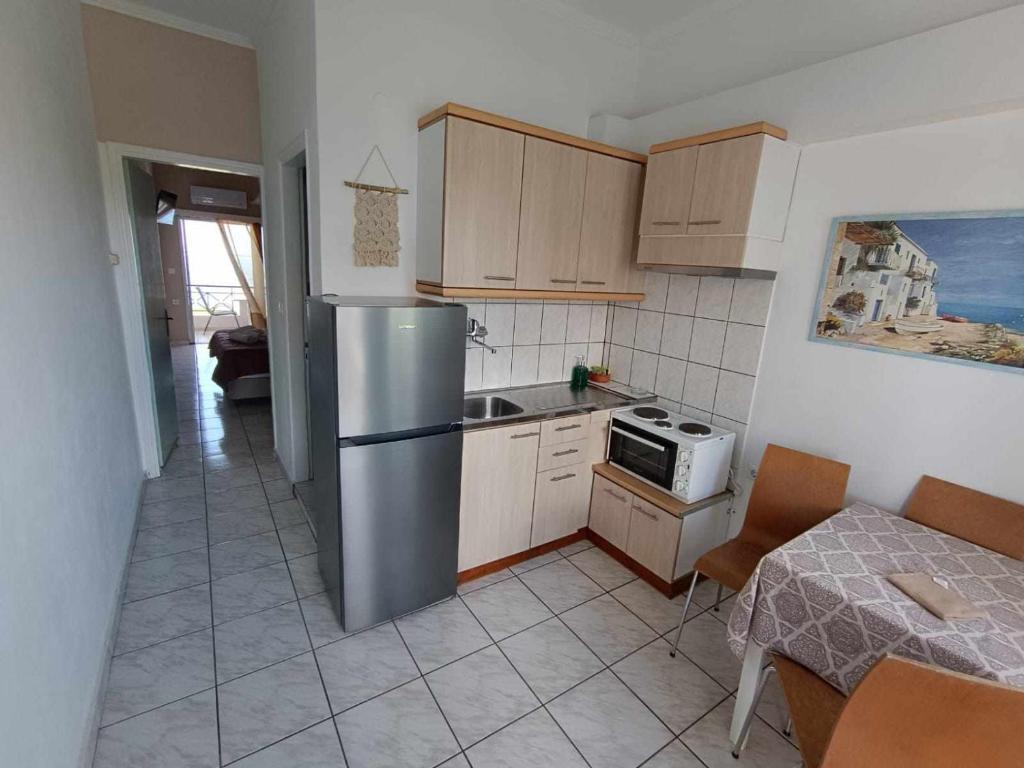 Kuchyň nebo kuchyňský kout v ubytování Faros Apartments