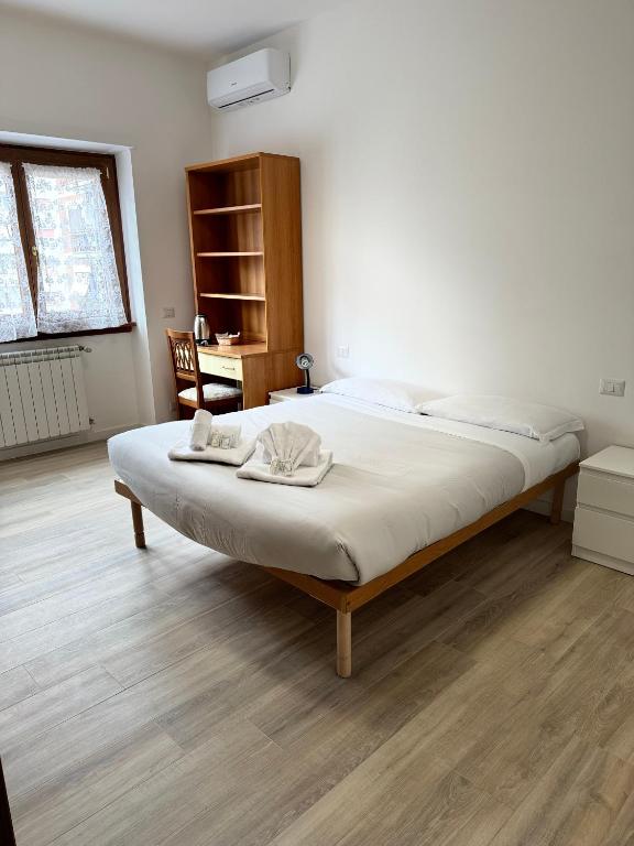 a bedroom with a large bed in a room at Cerreto Suite Housing in Rome