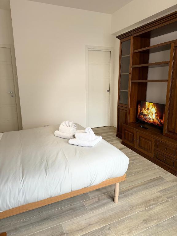 a bedroom with a bed with two towels on it at Cerreto Suite Housing in Rome