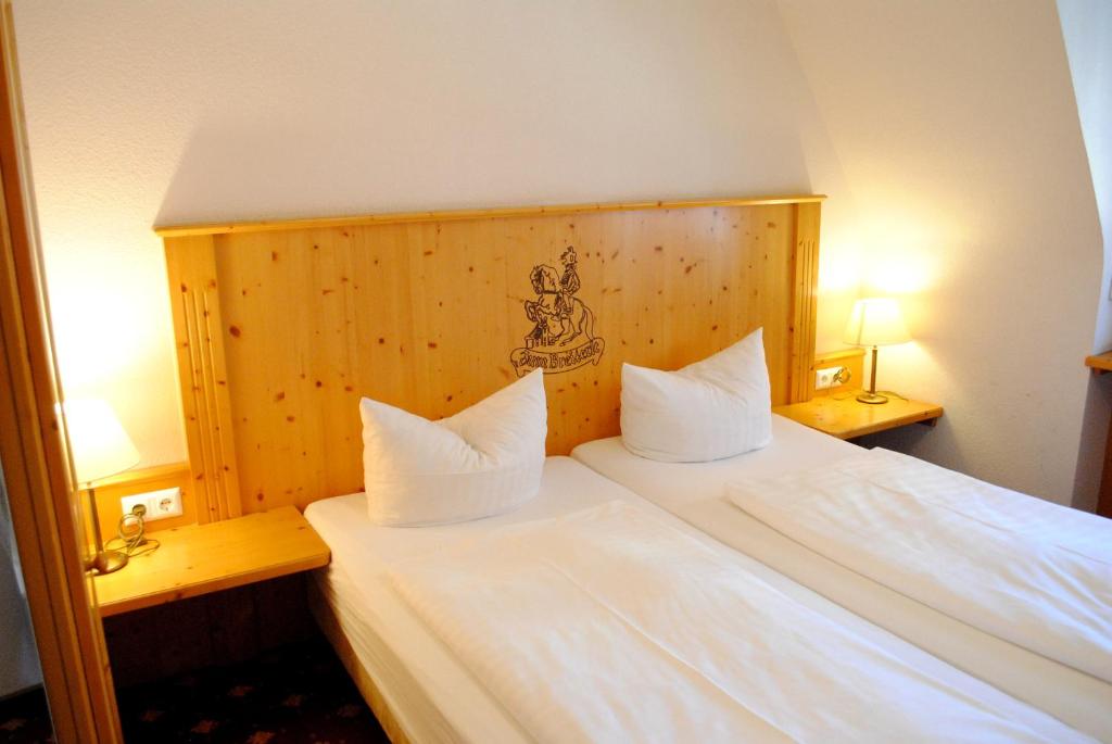 Postel nebo postele na pokoji v ubytování Hotel Zum Breiterle