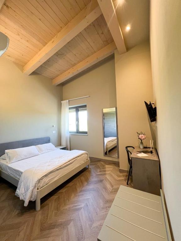 Postel nebo postele na pokoji v ubytování Tenute Masullo