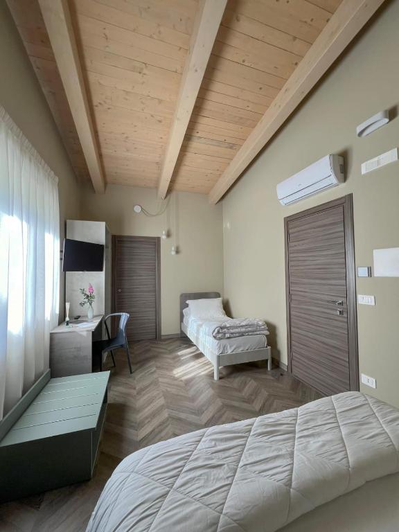 Postel nebo postele na pokoji v ubytování Tenute Masullo