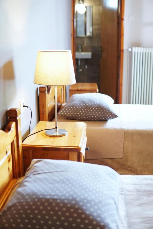 Postel nebo postele na pokoji v ubytování Hotel Defkalion