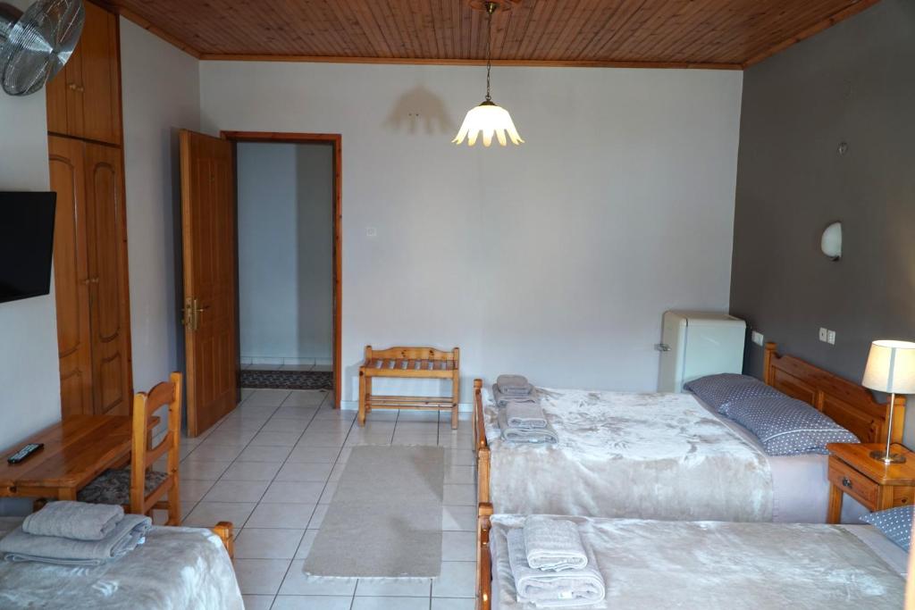 Postel nebo postele na pokoji v ubytování Hotel Defkalion