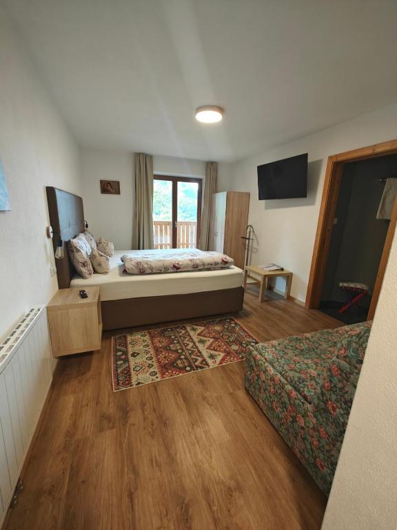 Postel nebo postele na pokoji v ubytování Schlossberg