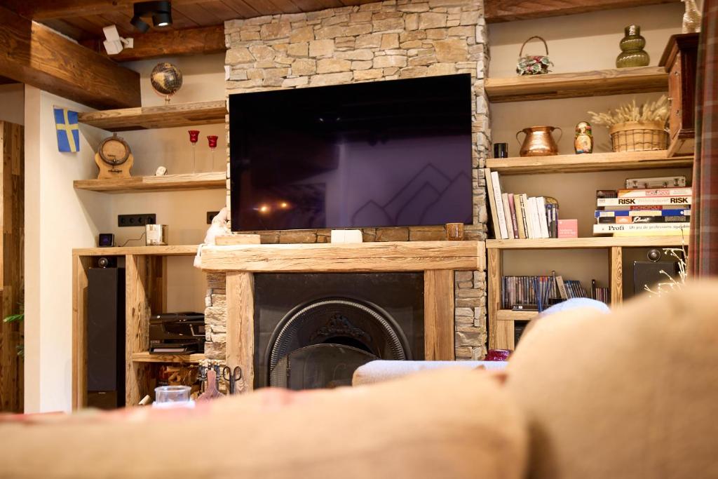 TV a/nebo společenská místnost v ubytování Pleta del Tarter 31A Lodge & SPA