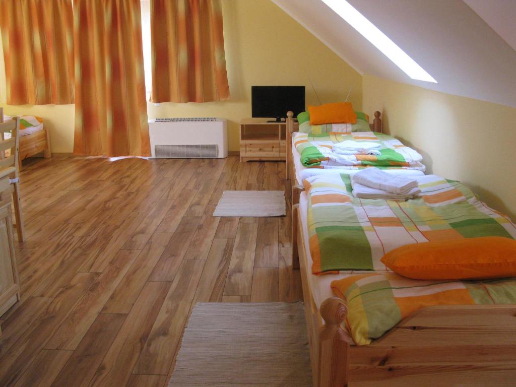 Postel nebo postele na pokoji v ubytování VIDOR Vendégház