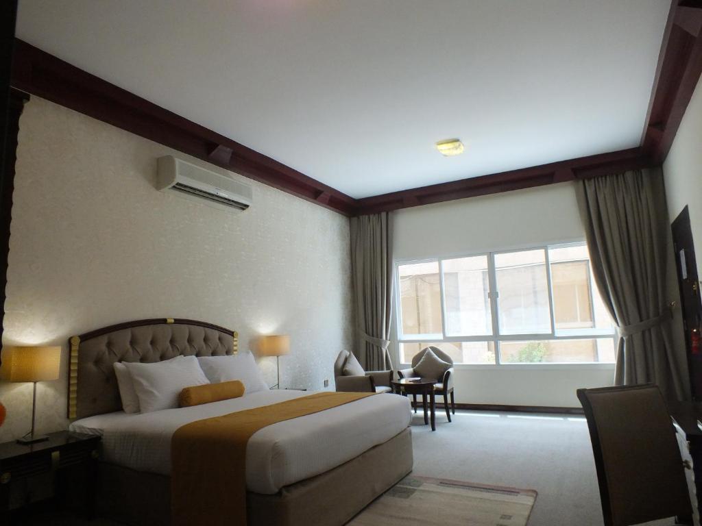 Postel nebo postele na pokoji v ubytování Verona Resorts Sharjah