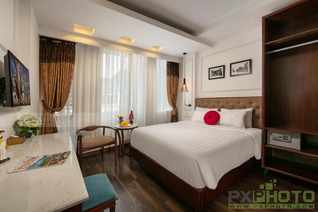 Postel nebo postele na pokoji v ubytování Victory Legend Hotel - In Hanoi Central