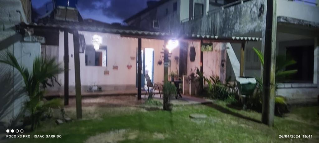 a house with a light on the front of it at Casas 1 de Isaac in Maragogi