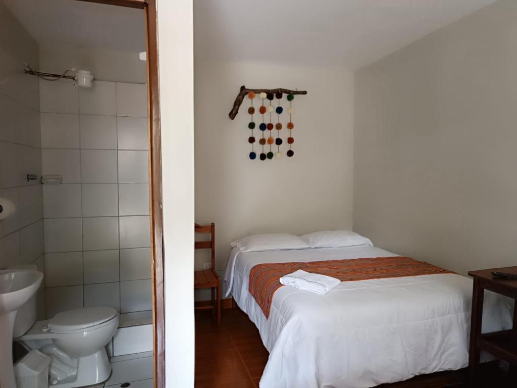 Postel nebo postele na pokoji v ubytování Hospedaje Quillabamba