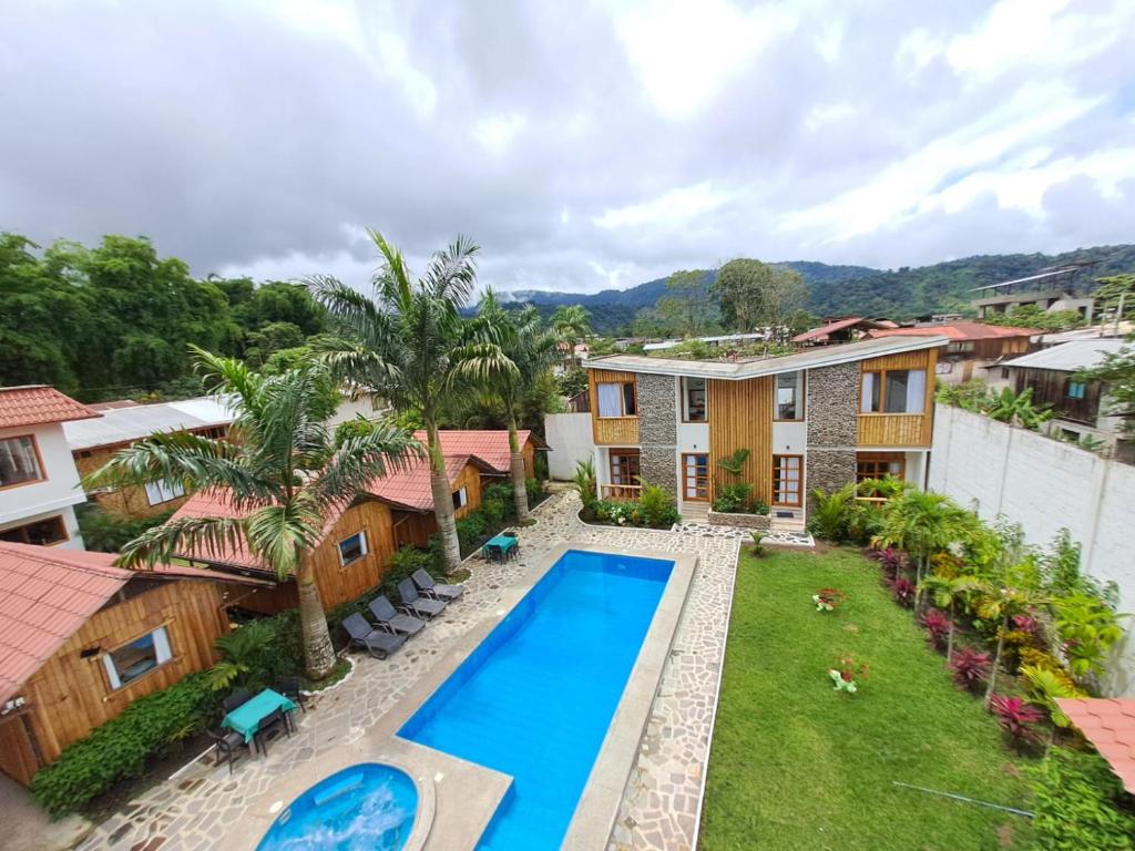 an aerial view of a house with a swimming pool at La Posada de Mindo in Mindo