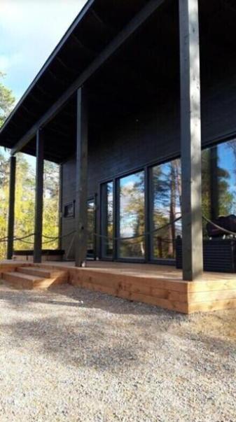 a building with a lot of windows on it at Villa Paadar in Inari