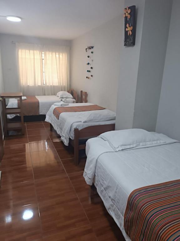 Postel nebo postele na pokoji v ubytování Hospedaje Quillabamba